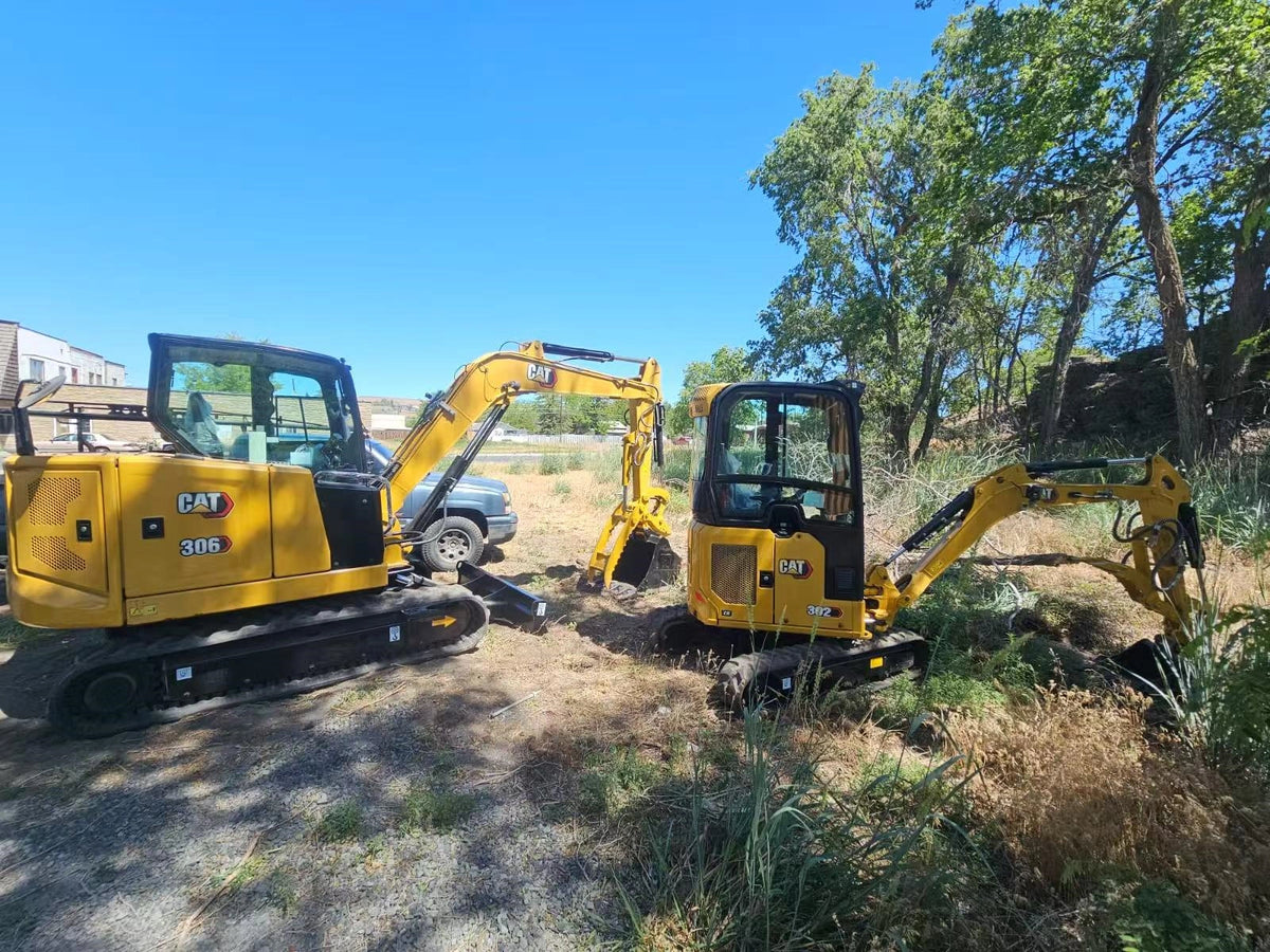 Two refurbished CAT mini excavators CAT 306 and CAT 302CR inspected by client after port delivery in New York