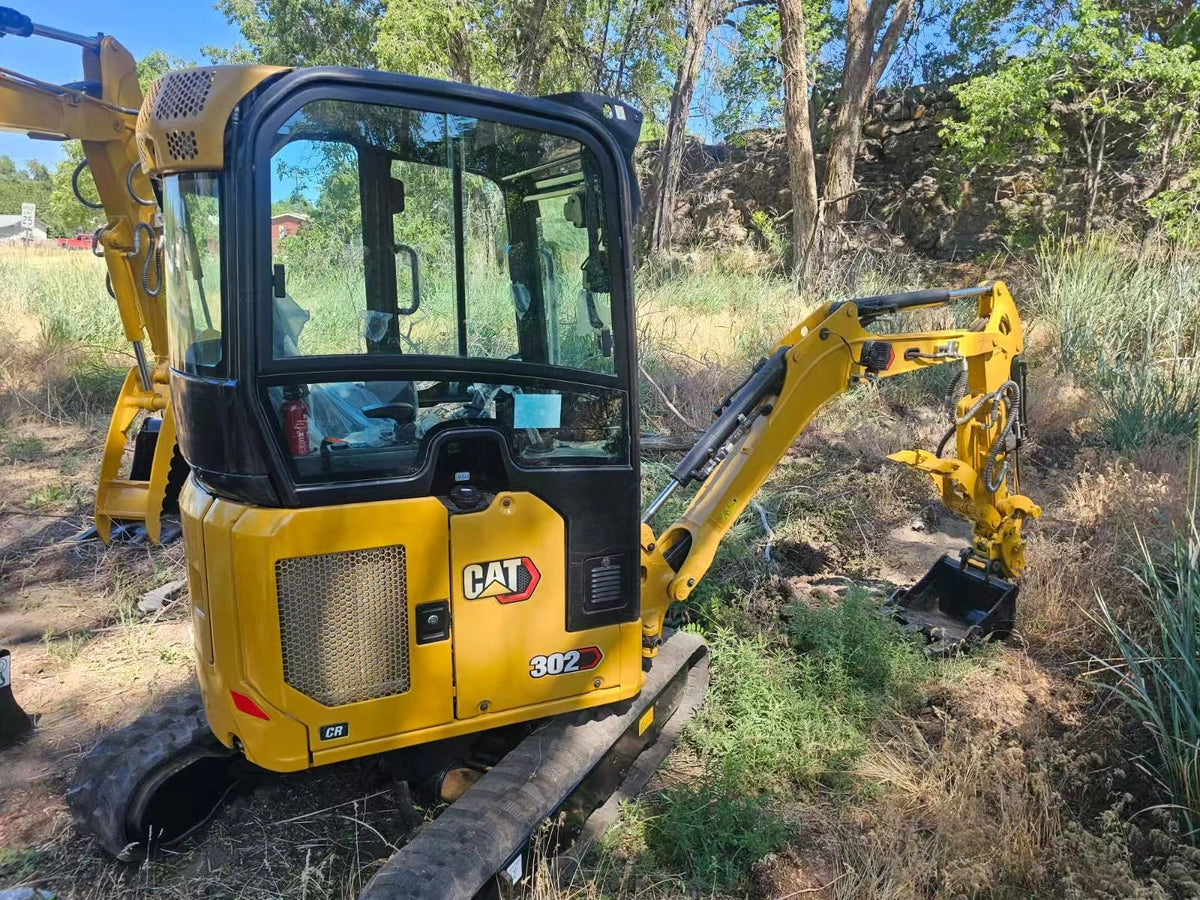 Side view of CAT 302CR mini digger inspected by customer at New York warehouse