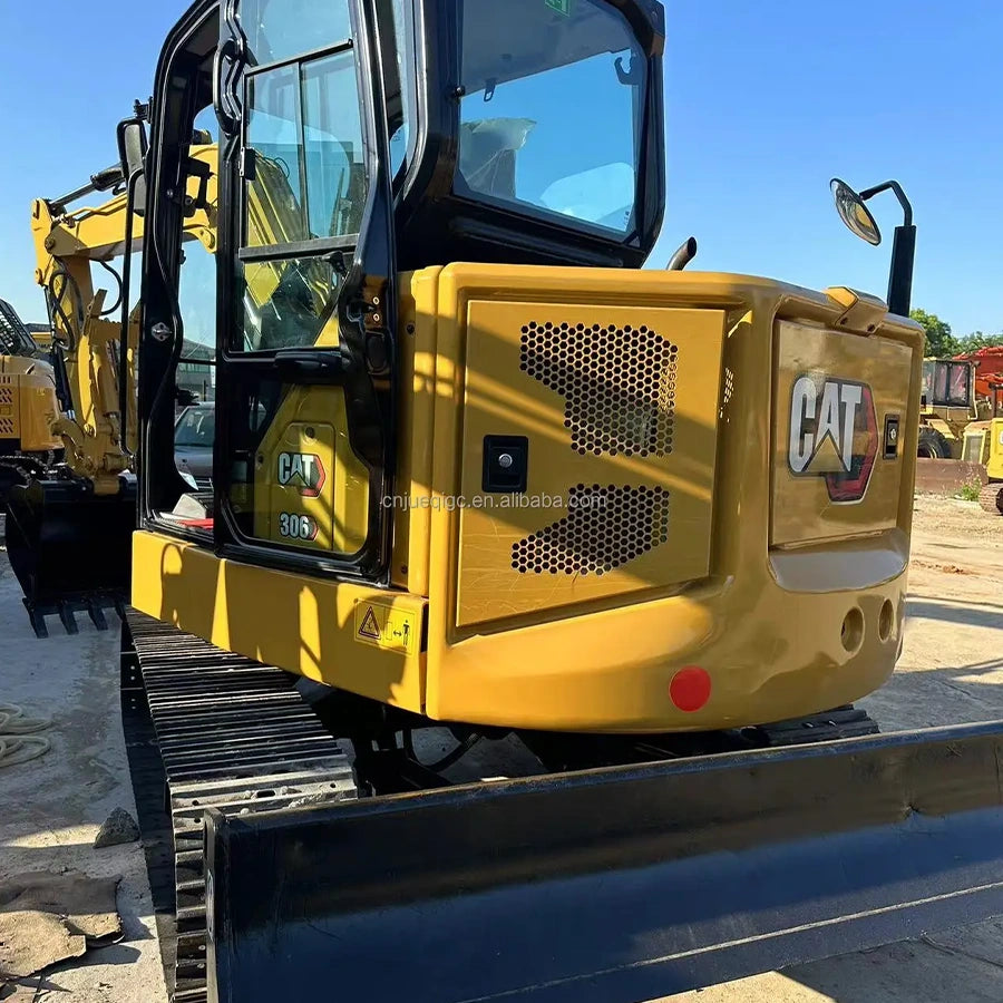 Fully renovated used CAT 306 mini excavator after professional refurbishment, like-new Caterpillar compact digger back side shot